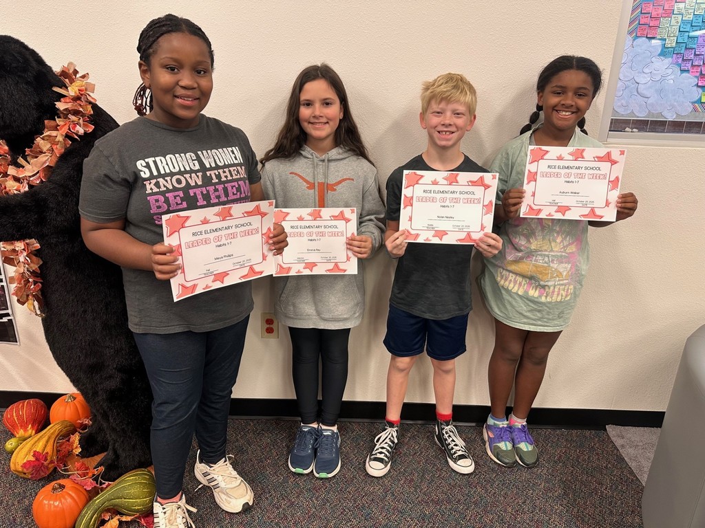 students holding certificates