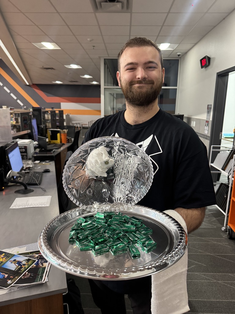 Waiter displaying a tray of chocolate mints
