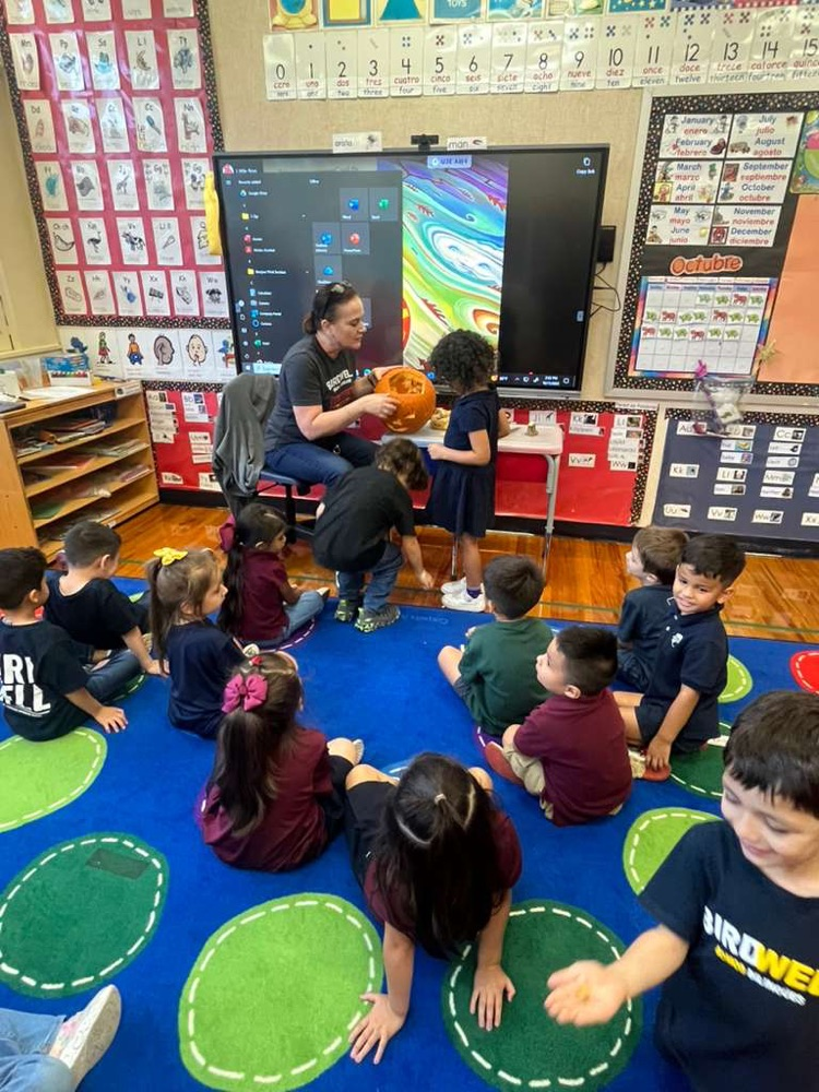 teacher with pumpkin