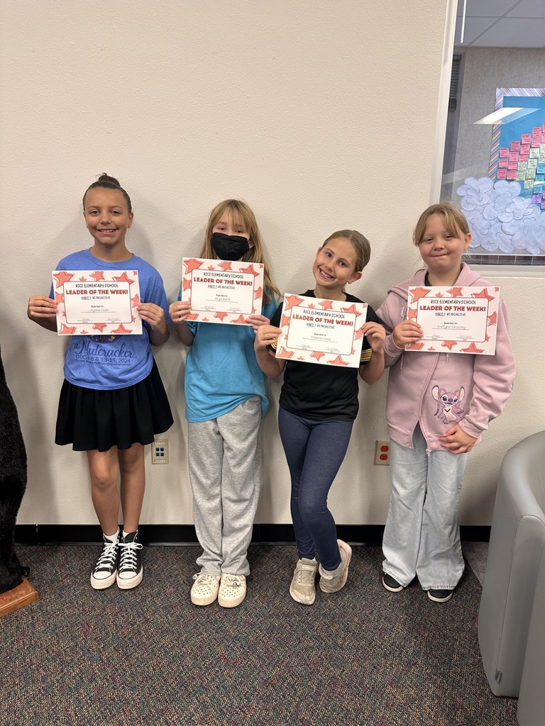 students holding certificates