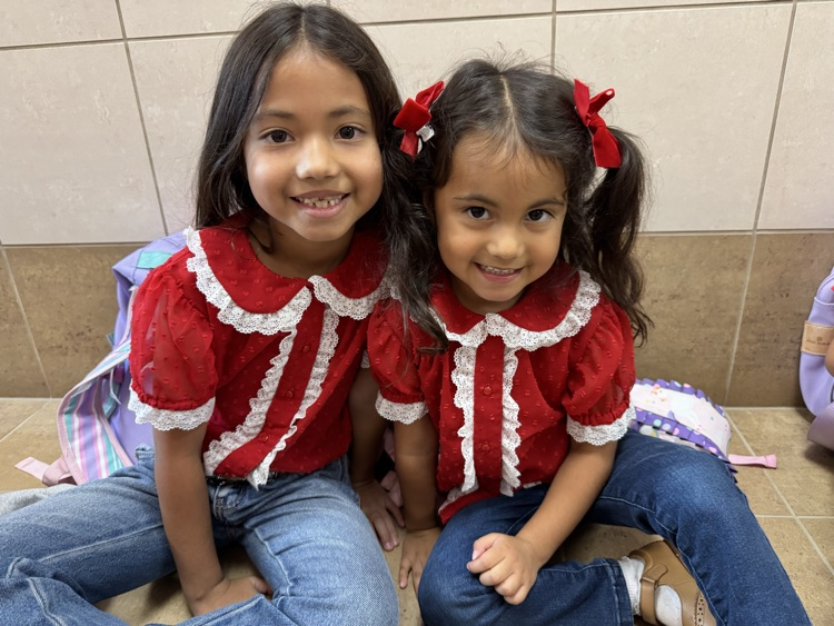 two sister wearing red