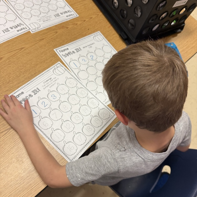 Student tracing pumpkin numbers 1 to 20