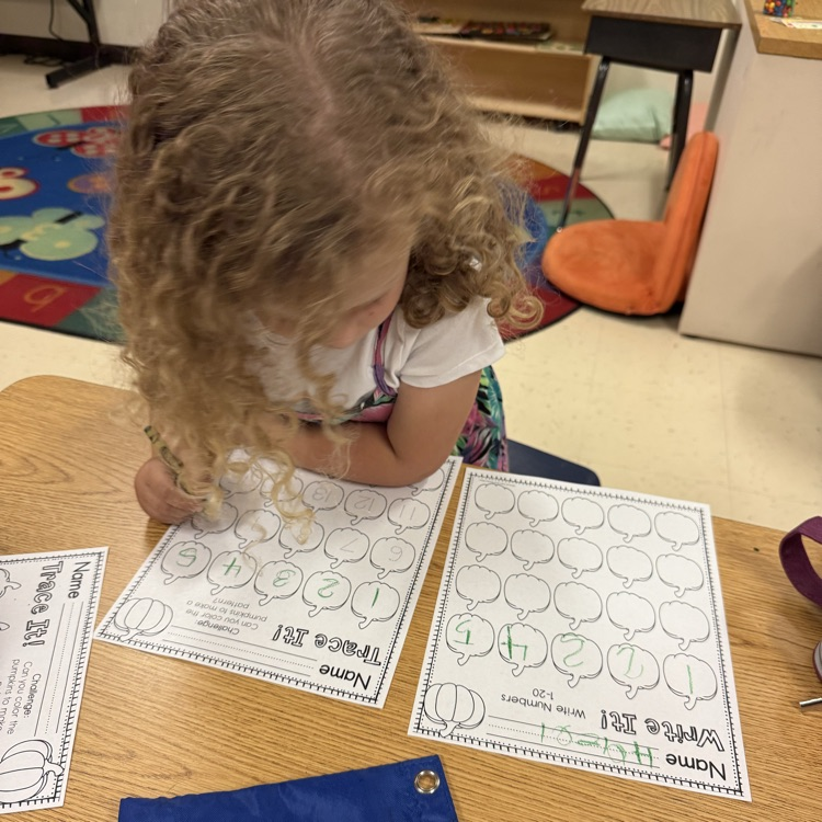 Student tracing pumpkin numbers 1 to 20