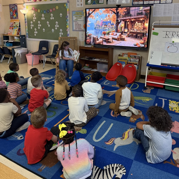 fourth grader reading to pre k class