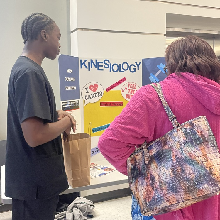 student talking to parents