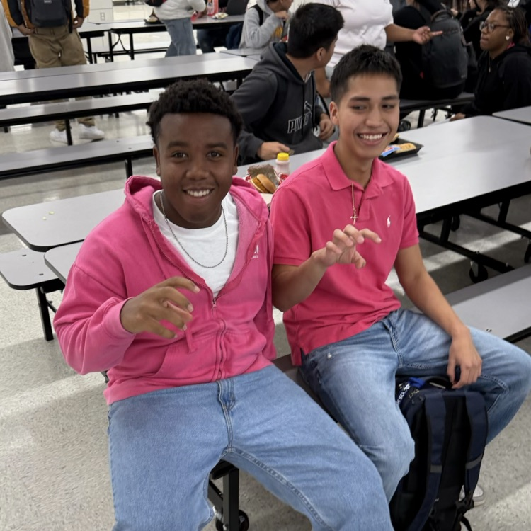 two students in pink