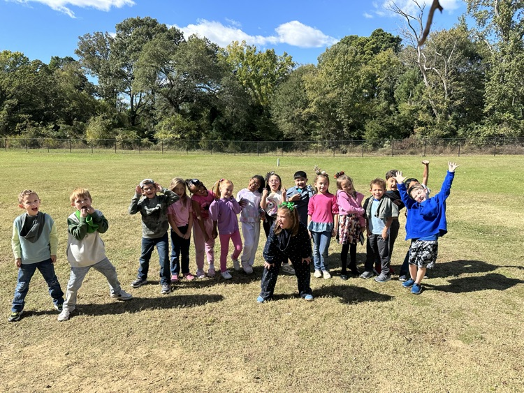 1st graders on the playground wearing silly clothing and making silly faces for Wacky Wednesday
