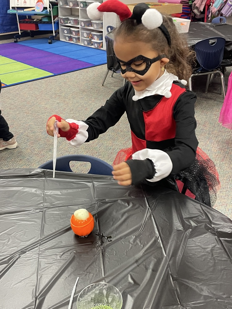 Kids doing Halloween activities.