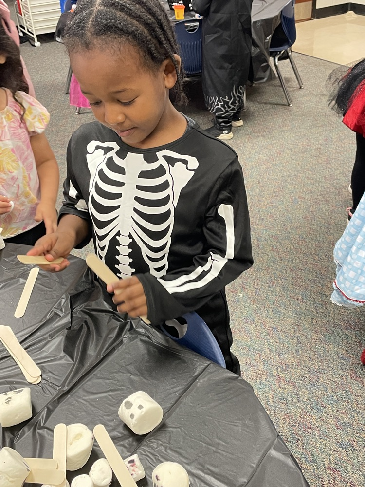 Kids doing Halloween activities.