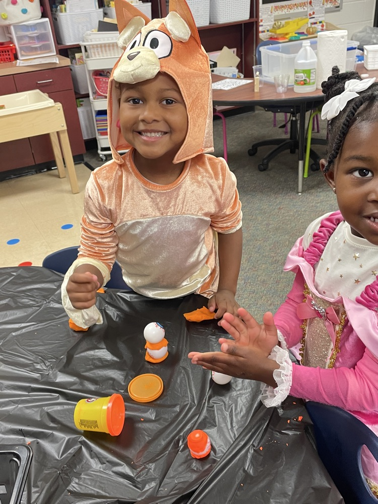 Kids doing Halloween activities.
