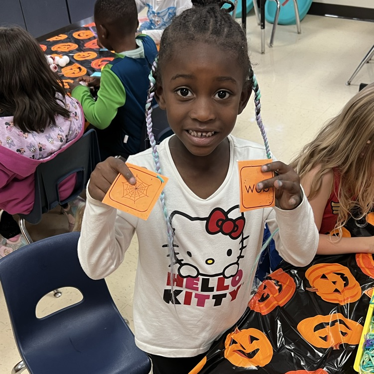 kindergarten students completing Halloween academic activities