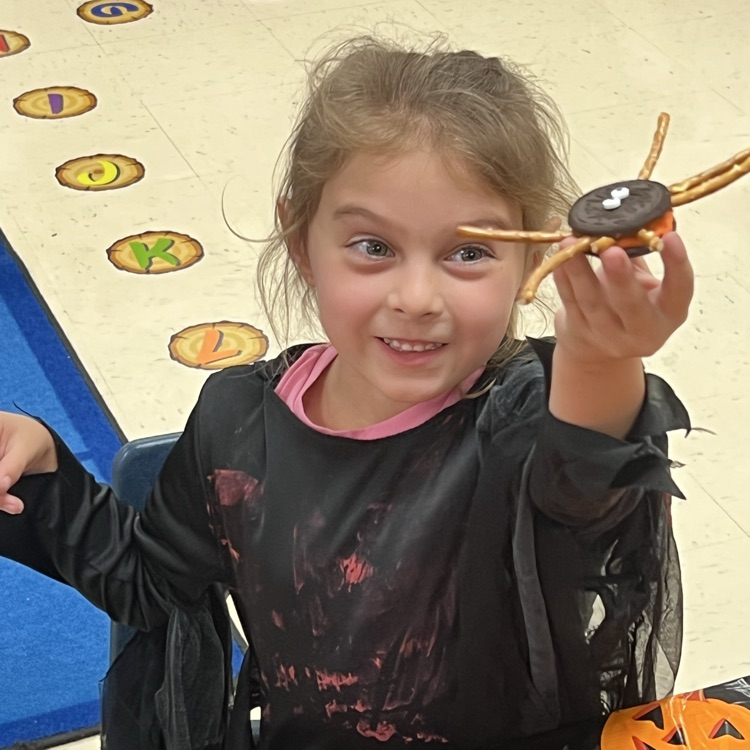kindergarten students completing Halloween academic activities