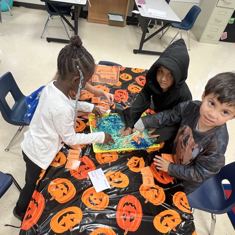 kindergarten students completing Halloween academic activities