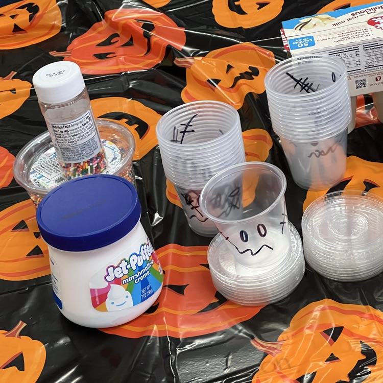 kindergarten students completing Halloween academic activities