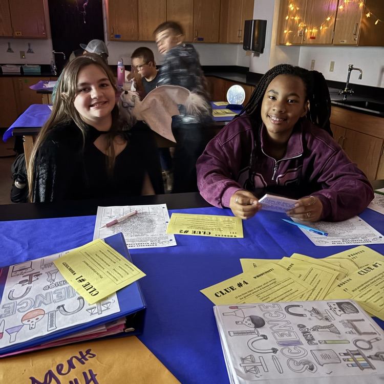 students completing a science activity 