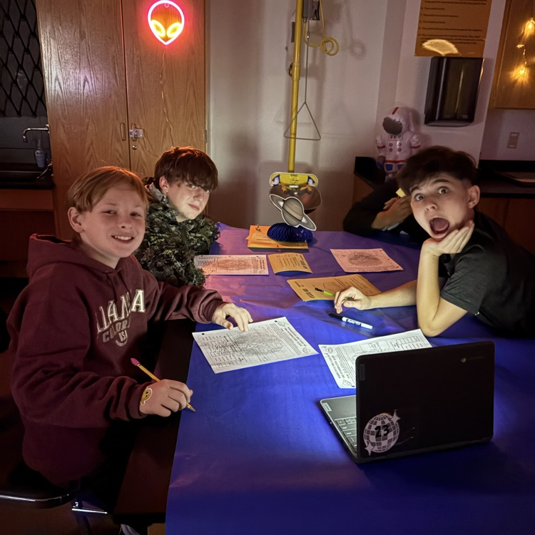 students completing a science activity 