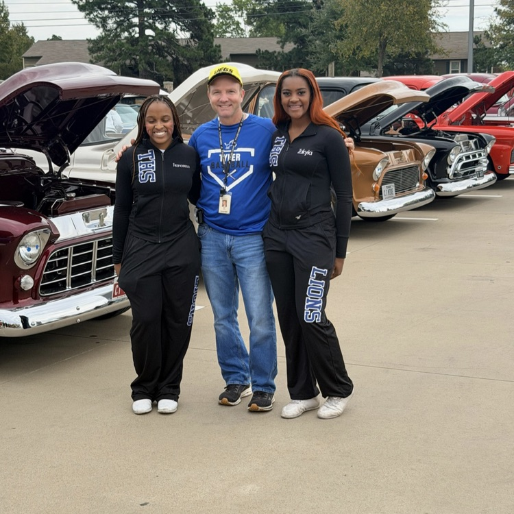 principal and cheerleaders