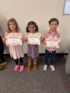 students holding certificates