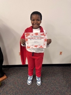 student holding a certificate