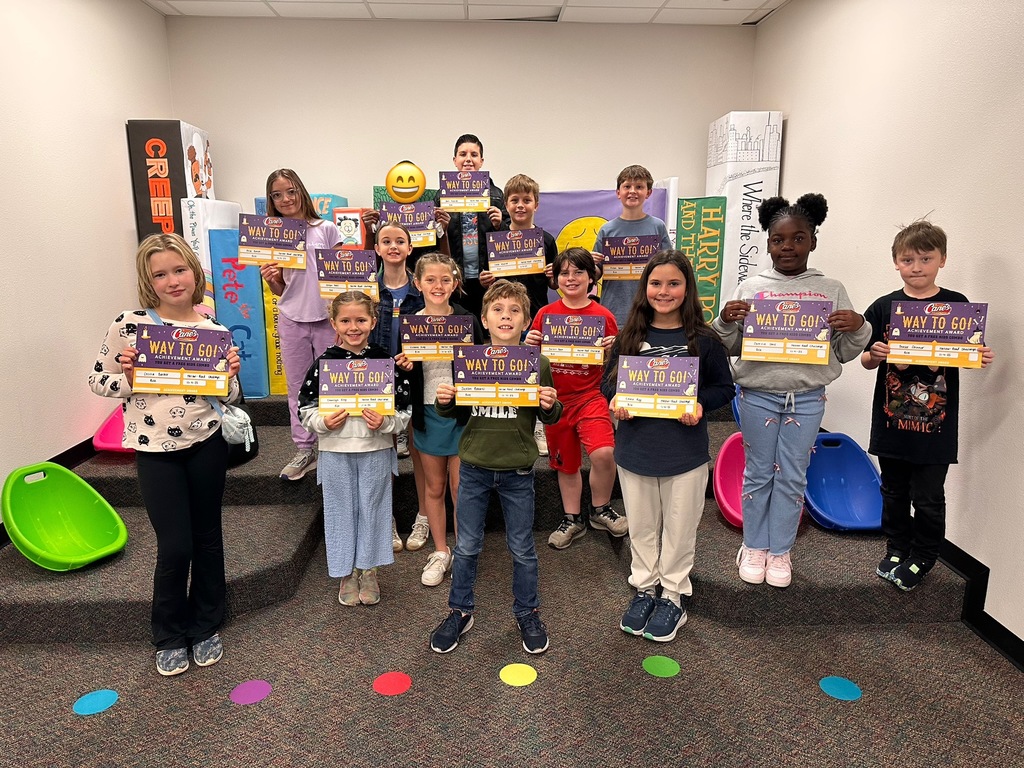 group of students holding certificates
