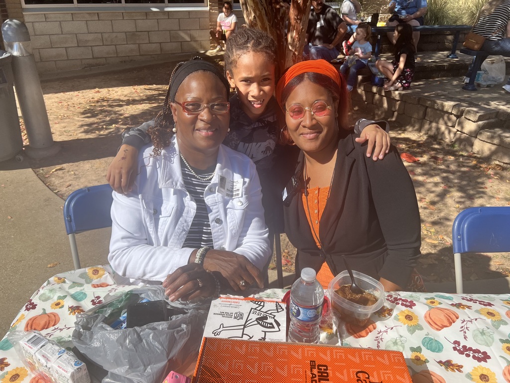 Parents eating with their student 