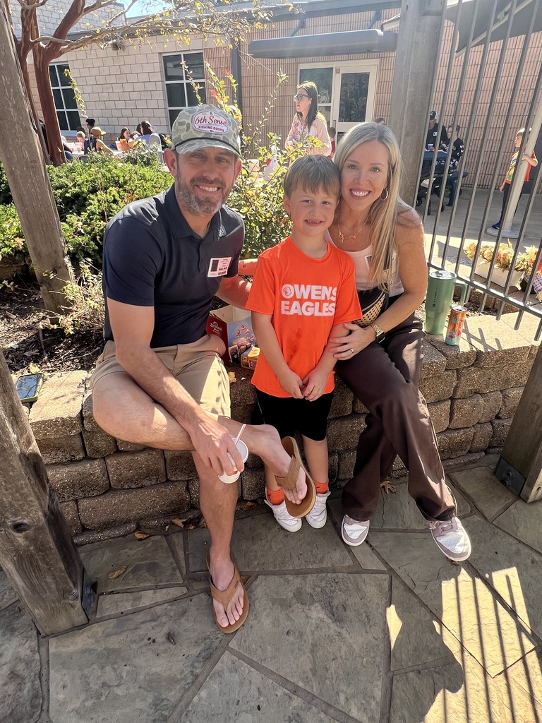 Parents eating with their student