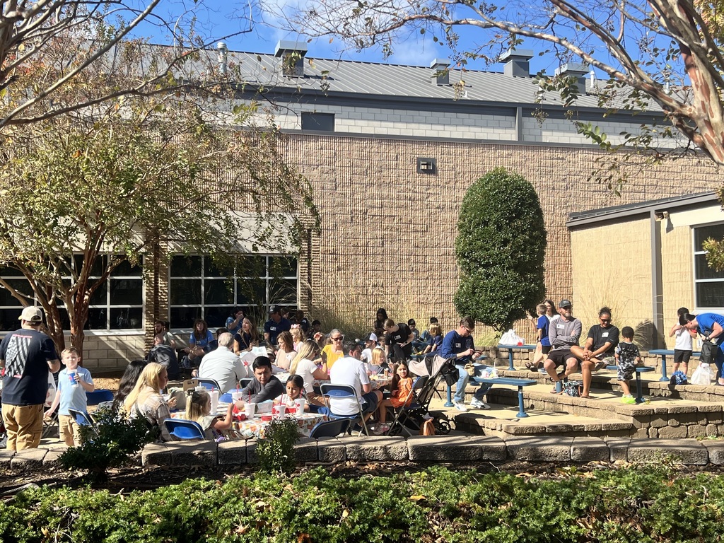 Parents  eating with their student