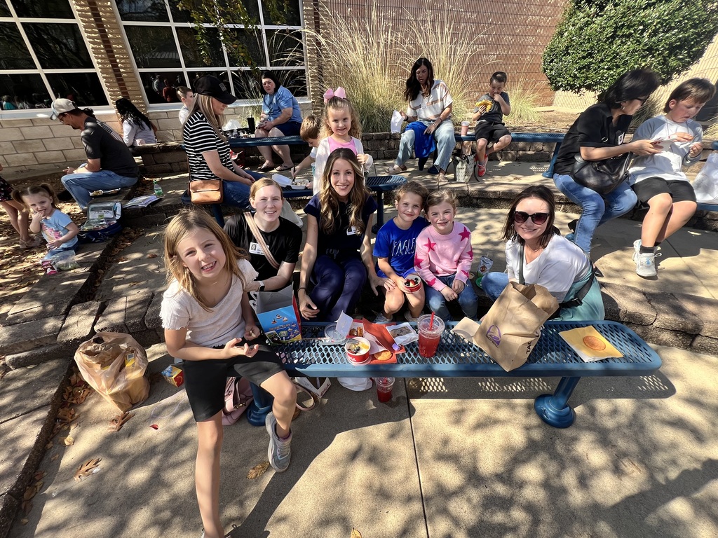 Parents eating with their student 