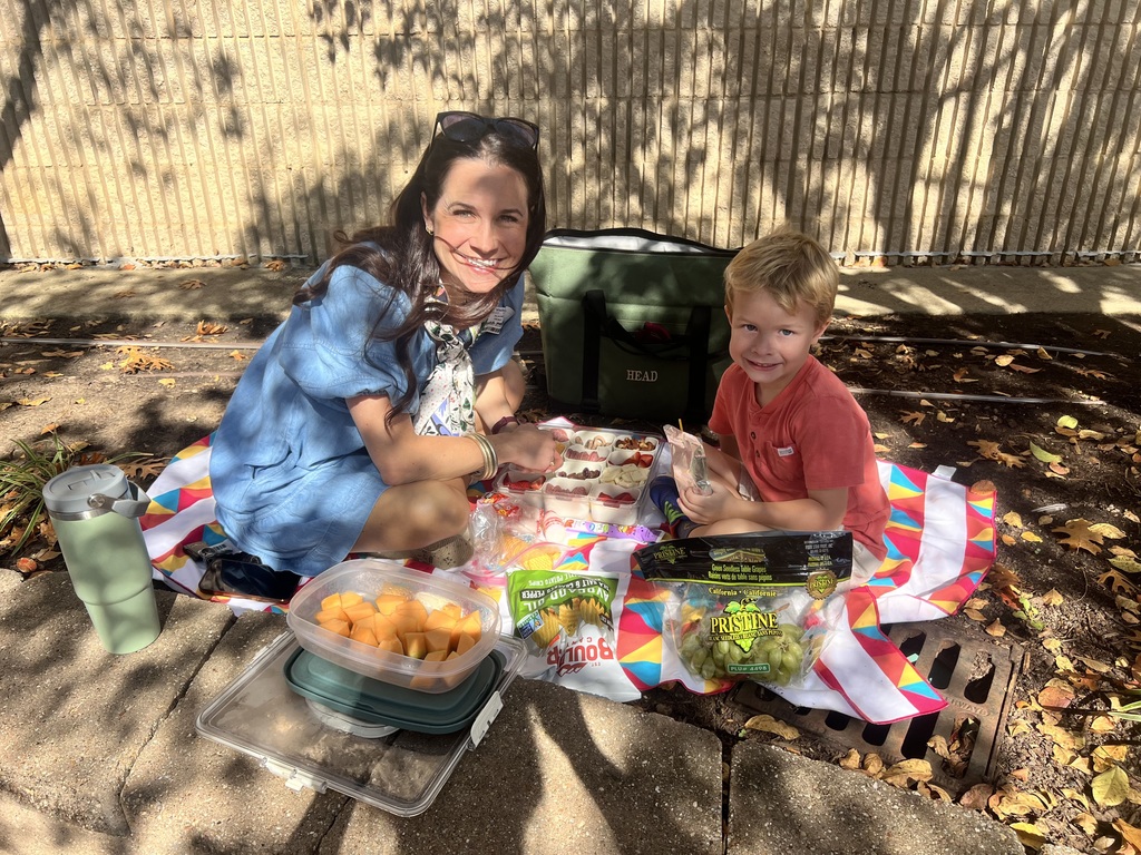Parent eating with their student