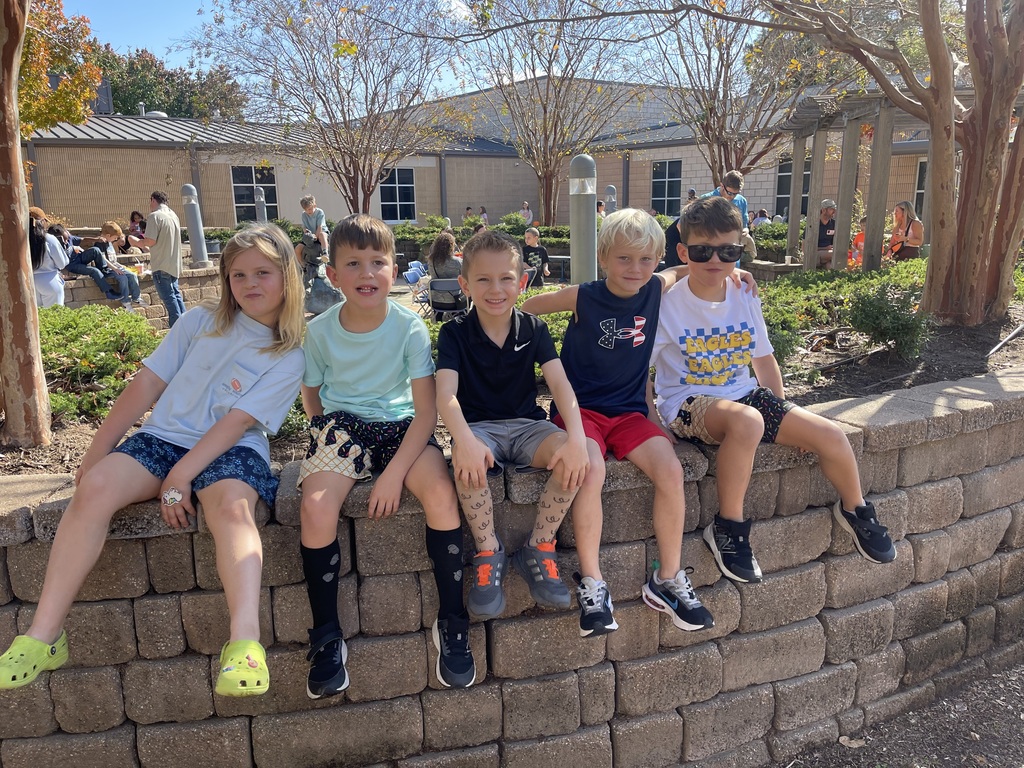 Student sitting on a wall