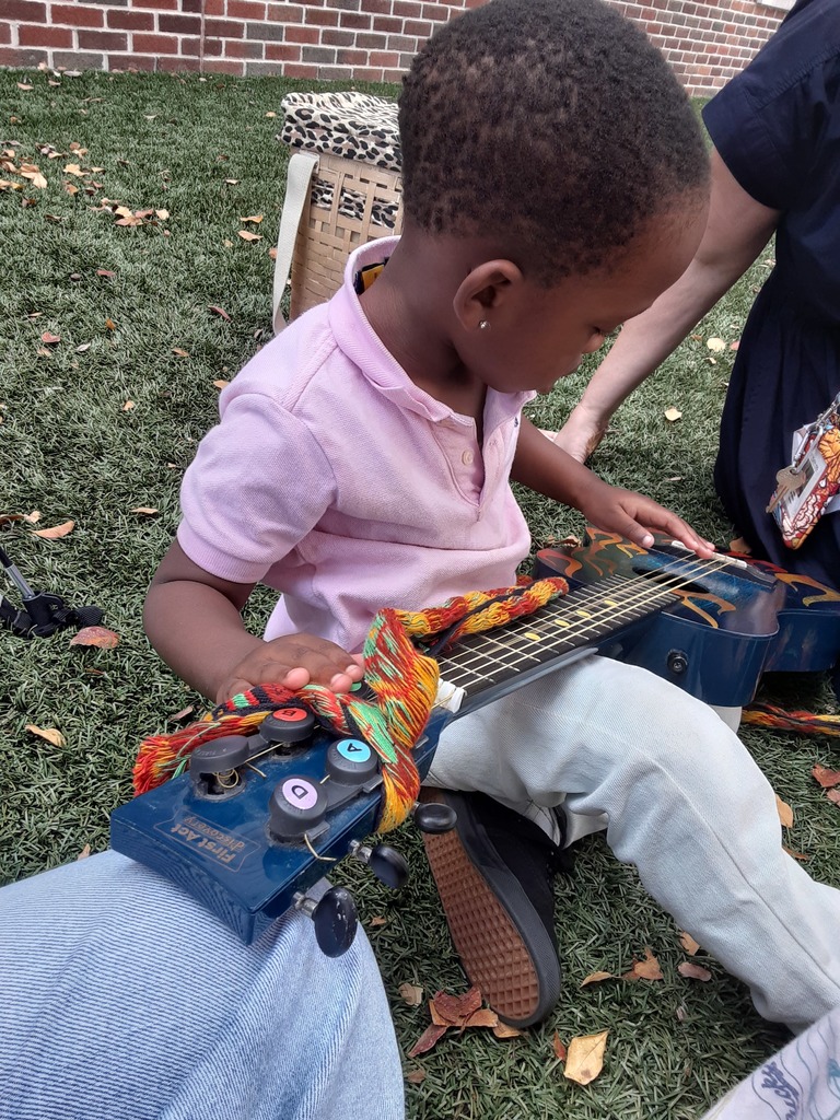 Child playing the guitar