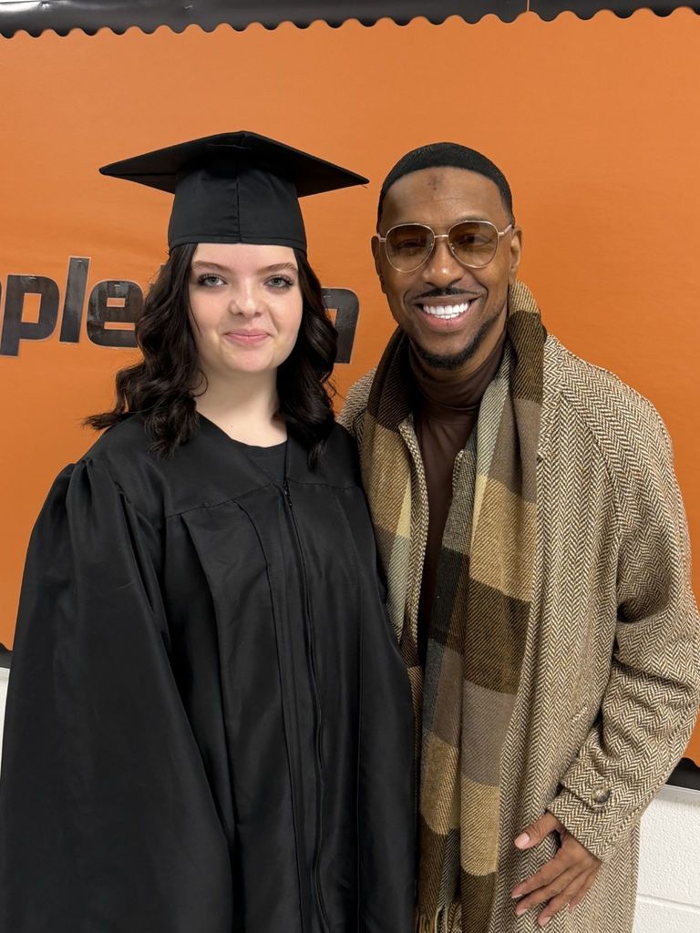 students posing with principal