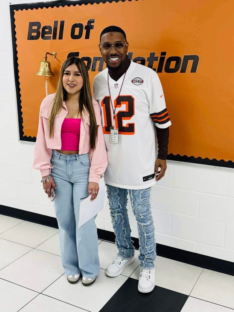 students posing with principal