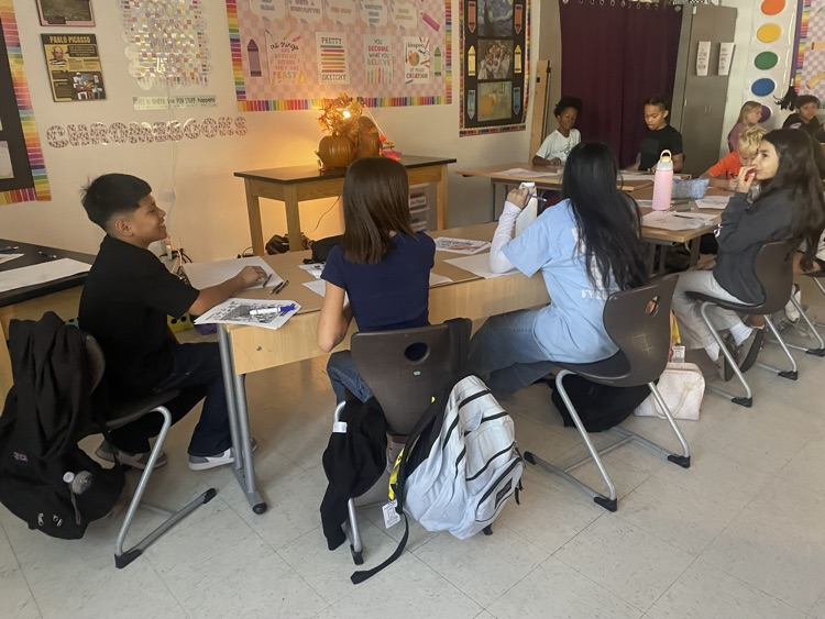 Students drawing in class.