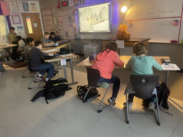 Students drawing in class.