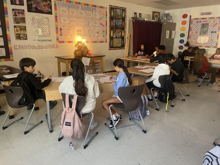 Students drawing in class.