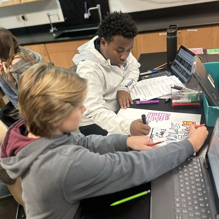 students making posters over galaxies