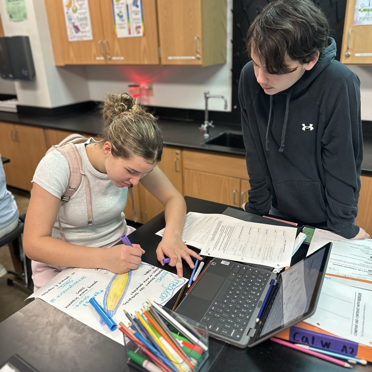 students making posters over galaxies