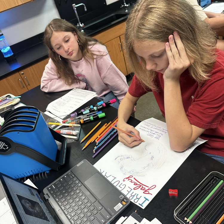 students making posters over galaxies