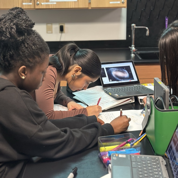 students making posters over galaxies