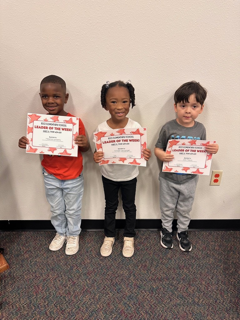 students holding certificates