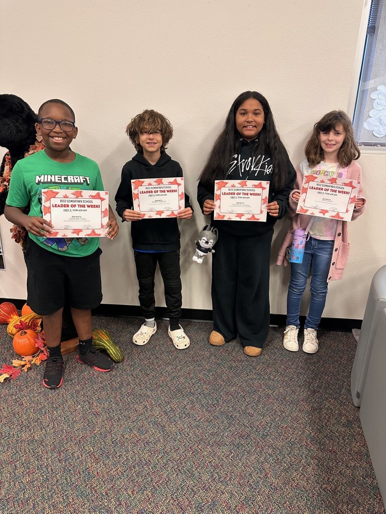 students holding certificates