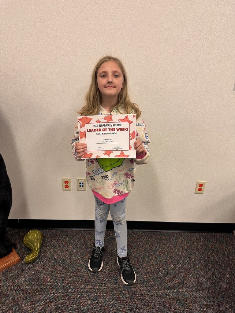 student holding a certificate