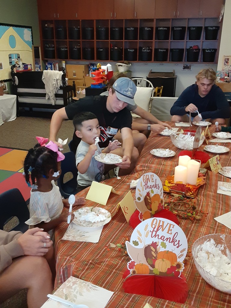 High school student and preschool student eating together