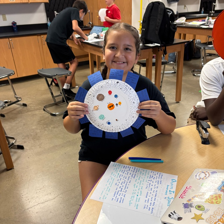 student holding project 