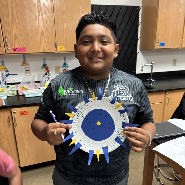 student holding project 