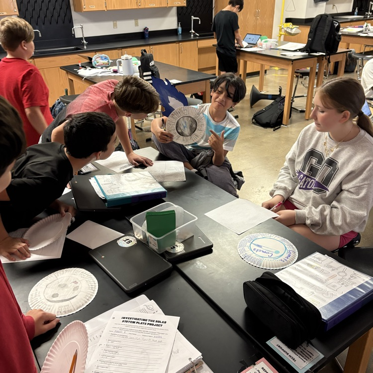 student holding project 