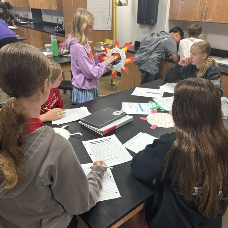 student holding project 