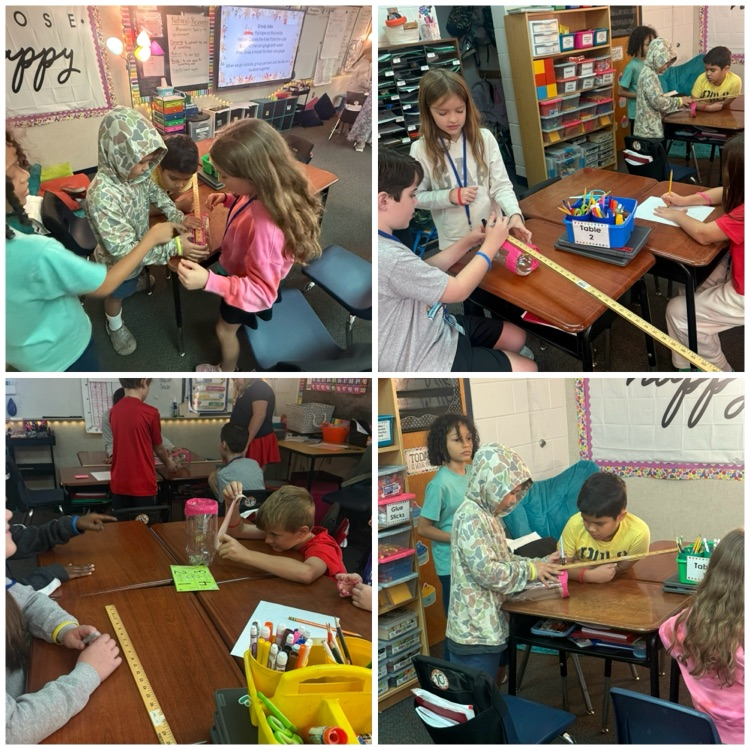 Students are working in groups creating rain gauges