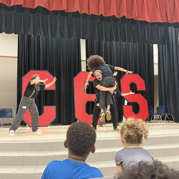 students watching a fairy tale play on stage in the cafe